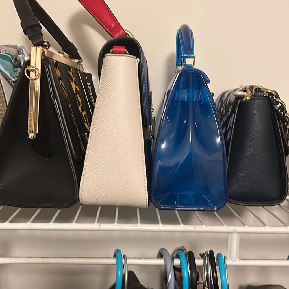 11 handbags most are new or used once bags